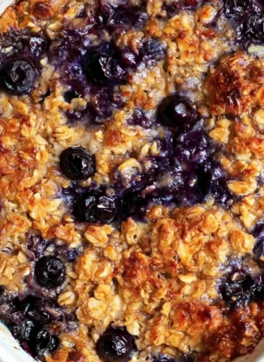 Delicious blueberry baked oatmeal topped with fresh blueberries and nuts