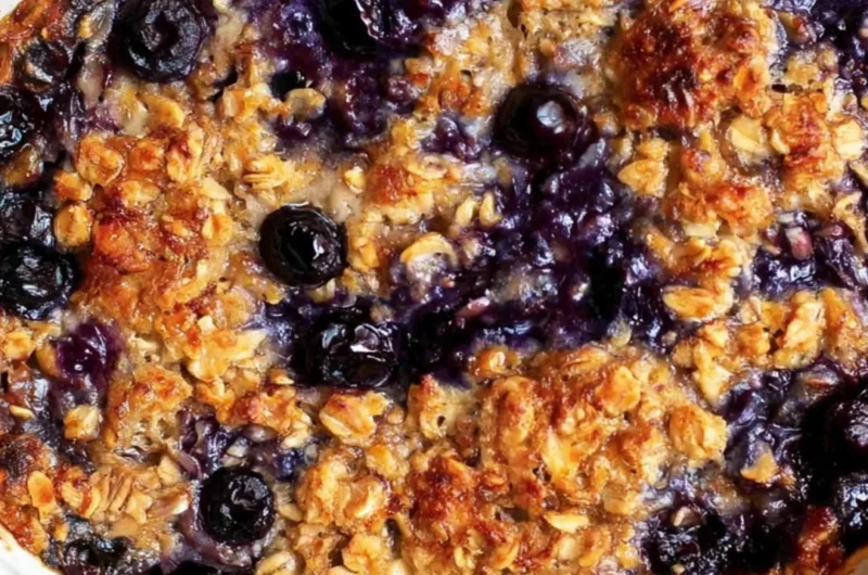 Delicious blueberry baked oatmeal topped with fresh blueberries and nuts