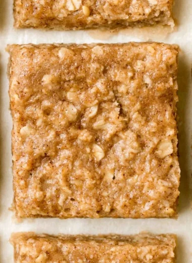 Homemade healthy breakfast bars on a wooden table.