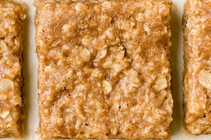 Homemade healthy breakfast bars on a wooden table.