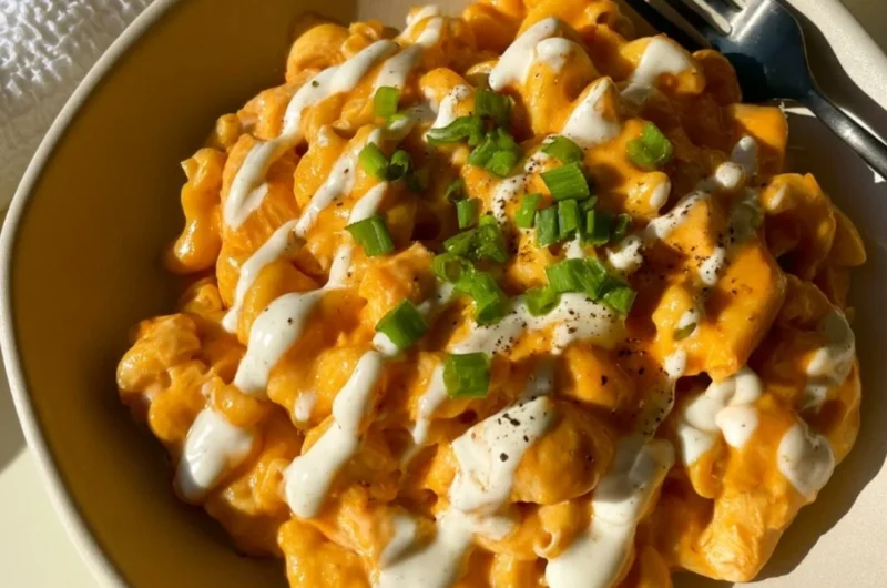 High protein buffalo chicken pasta dish with chicken and pasta in a creamy sauce