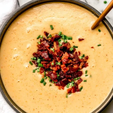 High-protein cream of potato soup served in a bowl with herbs on top