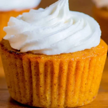 Delicious Impossible Pumpkin Pie Cupcakes topped with whipped cream