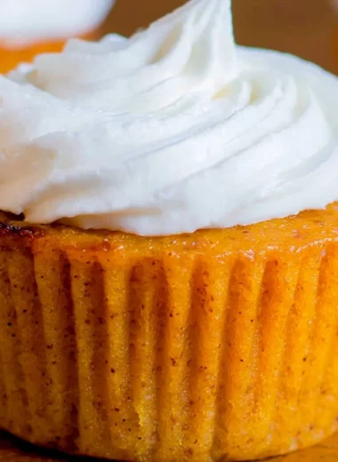 Delicious Impossible Pumpkin Pie Cupcakes topped with whipped cream
