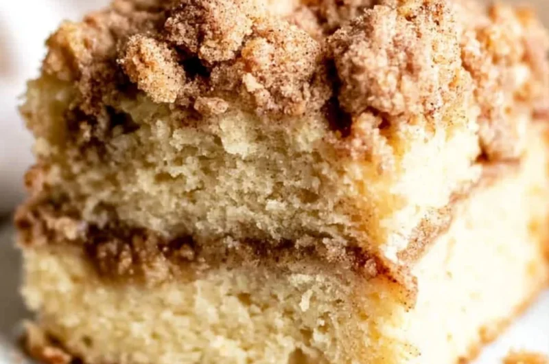 Sour cream coffee cake topped with cinnamon swirl and crumble